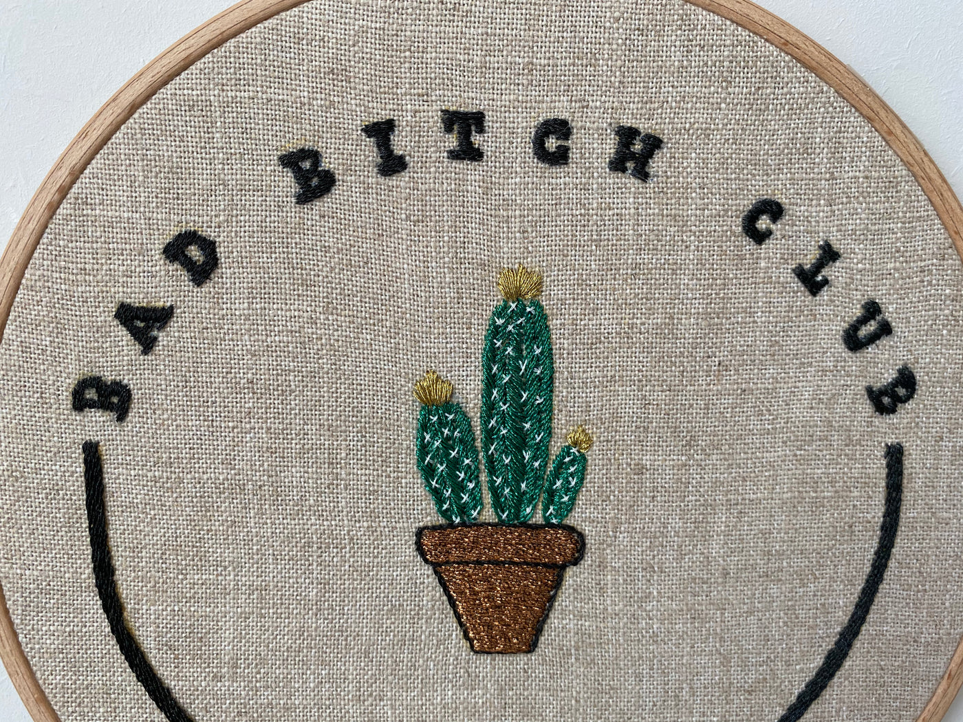 Detail of the potted cactus and stitched lettering in the Bad Bitch Club design