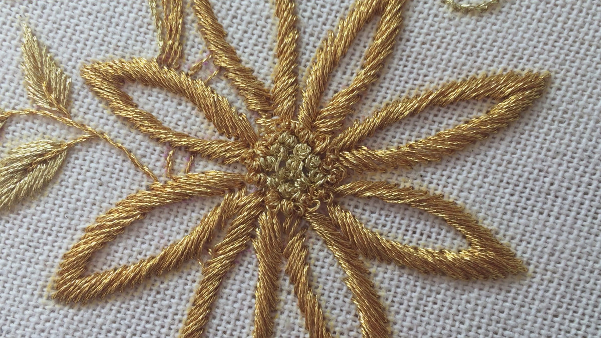 Video of the gilded daisy spray hand embroidery in its hoop