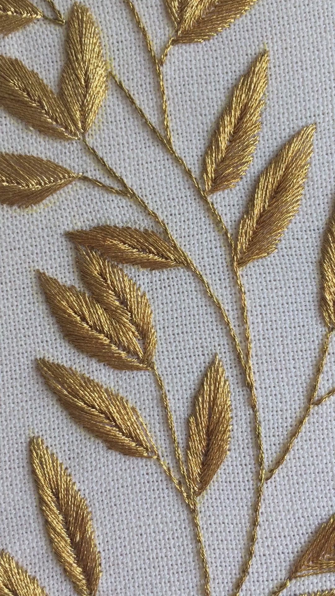 Video of the golden laurel sprig hand embroidery in its hoop