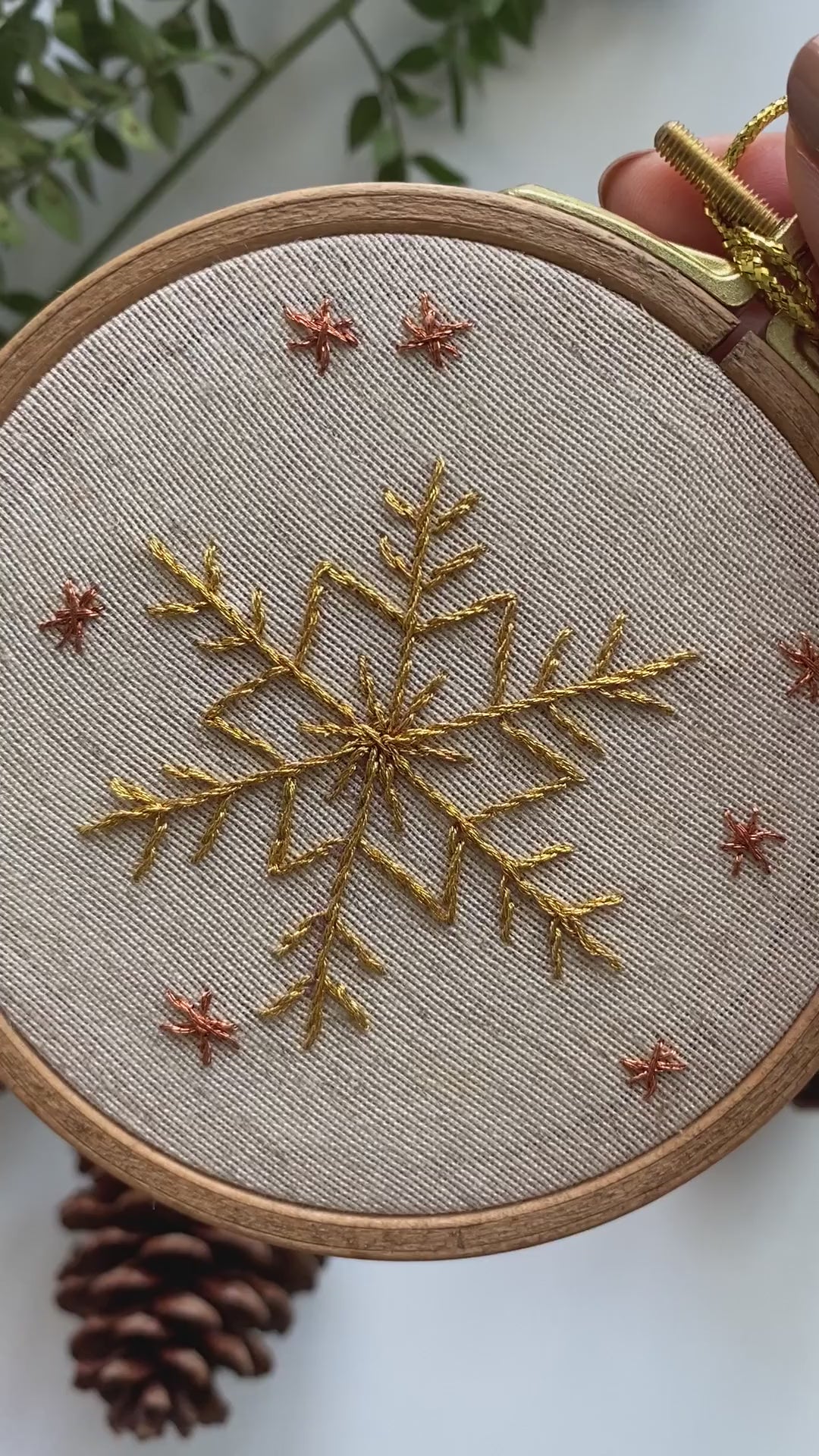 Video of the golden snowflake hand embroidery in its hoop